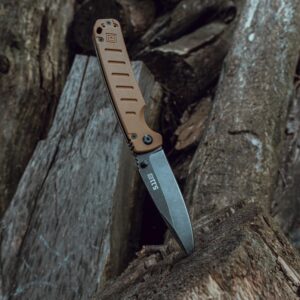 Bushcraft knife leaning against log — demo image